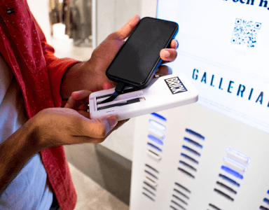 Guy charging his phone with a Brick